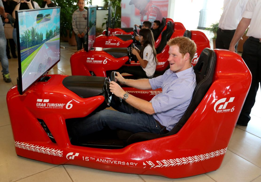 Royal racers: Prince Harry piloting an F1 driving simulator at the Ayrton Senna Institute, Sao Paulo, Brazil in 2014. 
