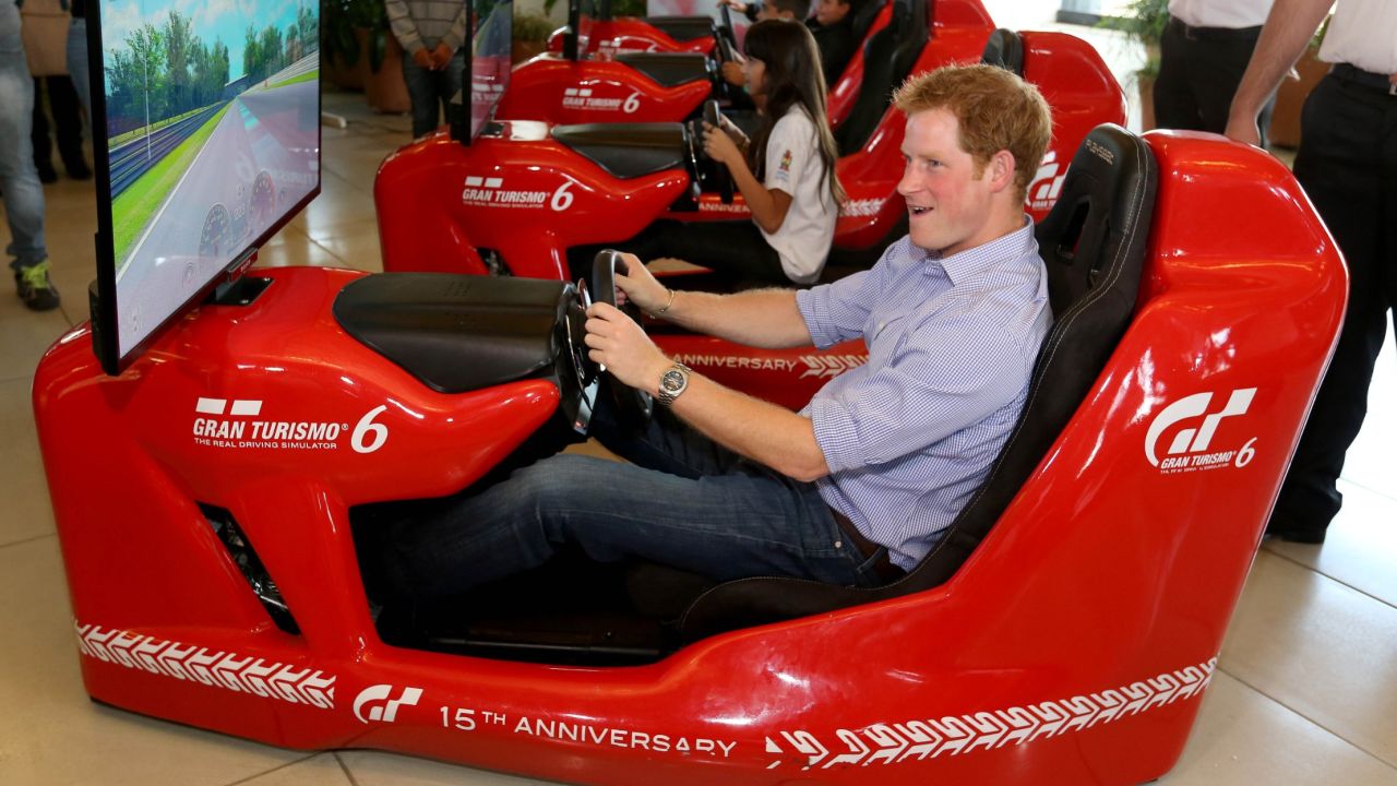 Royal racers: Prince Harry piloting an F1 driving simulator at the Ayrton Senna Institute, Sao Paulo, Brazil in 2014. 