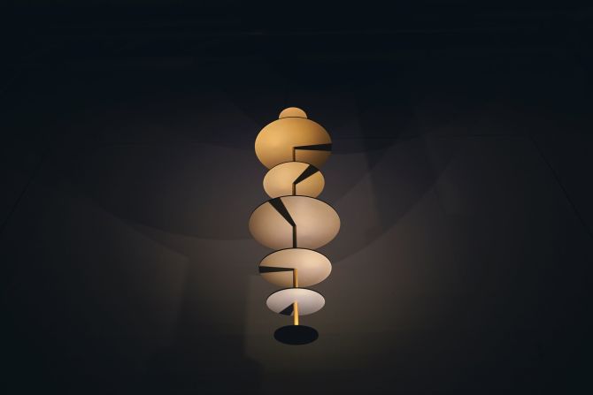 Made of a series of anodized aluminum disks, <a  target="_blank" target="_blank">Maarten De Ceulaer's </a> Sundial Chandelier's are aligned along a central rod. The rod's shadow is set to project in different directions, as if illuminated by different  suns, arranged in a spiral pattern as your eye travels down the disks.  