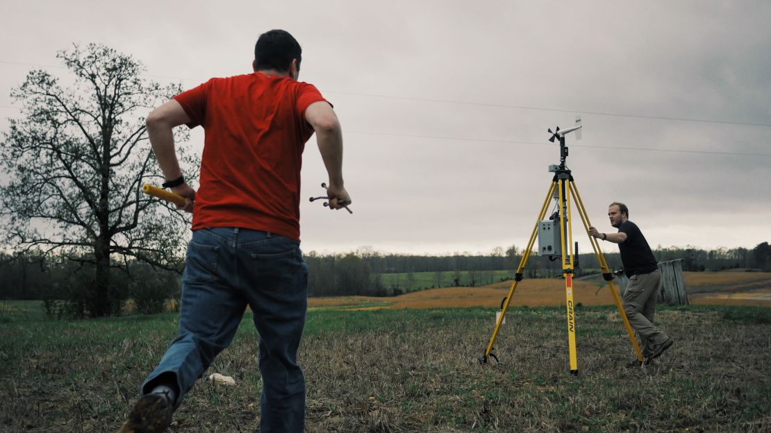 Chris Weiss (on the left) deploys a sticknet ahead of a storm in 2016.