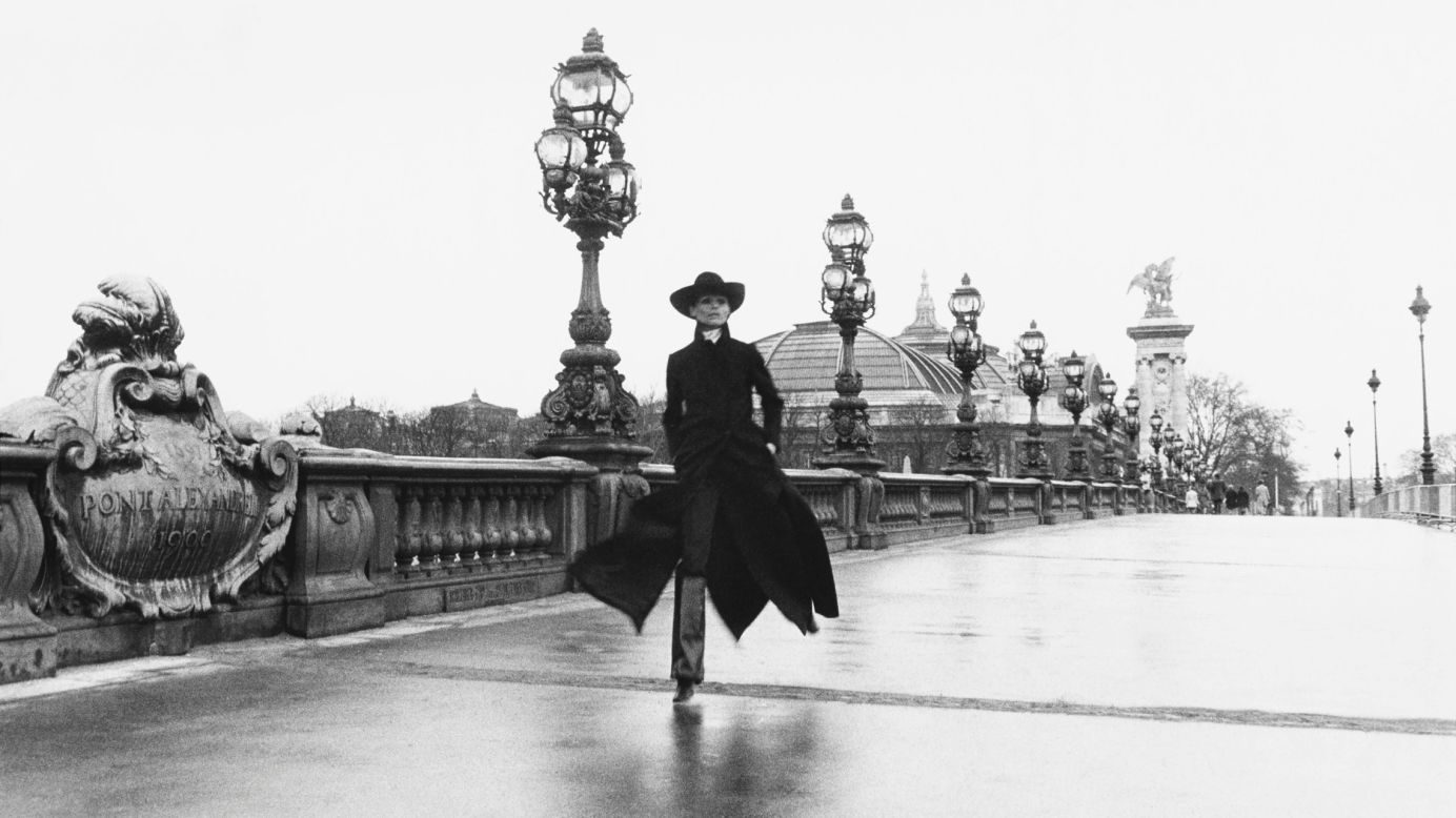 Model Chantal Dumont walks across the Pont Alexandre III, a Paris bridge, in 1969.
