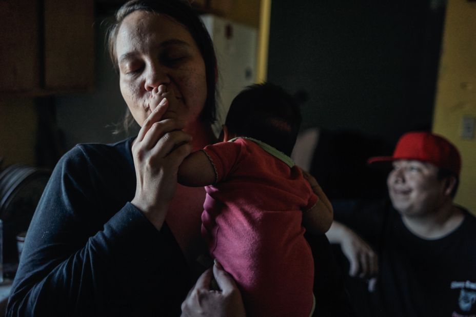 Inyan Pedersen, 34, holds her newborn daughter Sincere. Two of Inyan's younger children were born on a scheduled Cesarian, because the closest birthing center is two hours away.
