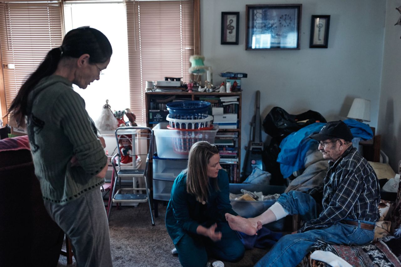 Larson examines Allen Marshall, 67, a home-bound patient with diabetes in Pierre, South Dakota.