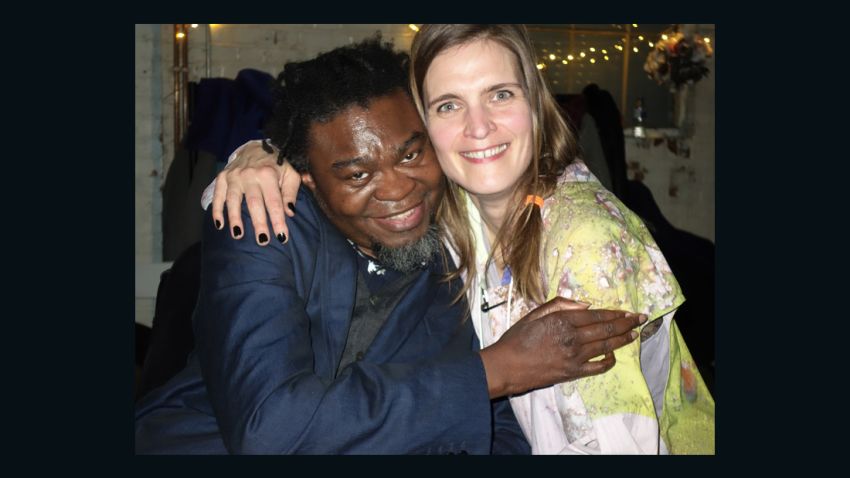 Katrin Lock, a German living in London, hugs her British friend, artist Yinka Shonibare.