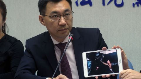 Taiwanese legislator Johnny Chiang shows a video image from the Kenyan jail cell.