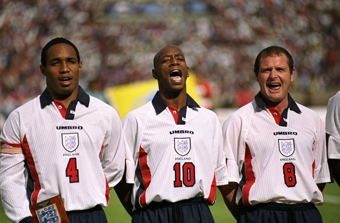 Wright belts out the national anthem alongside Paul Gascoigne and Paul Ince.