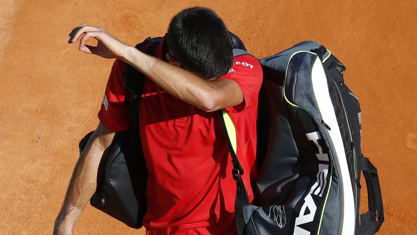 Serbia's Novak Djokovic leaves the court after losing a tennis match during the Monte-Carlo ATP Masters Series tournament, on April 13, 2016 in Monaco. . AFP PHOTO / VALERY HACHE / AFP / VALERY HACHE (Photo credit should read VALERY HACHE/AFP/Getty Images)