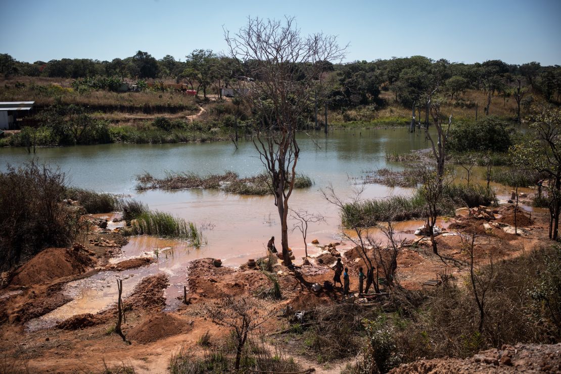 Workers extracting cobalt from a lake in Katanga province, DR Congo. 