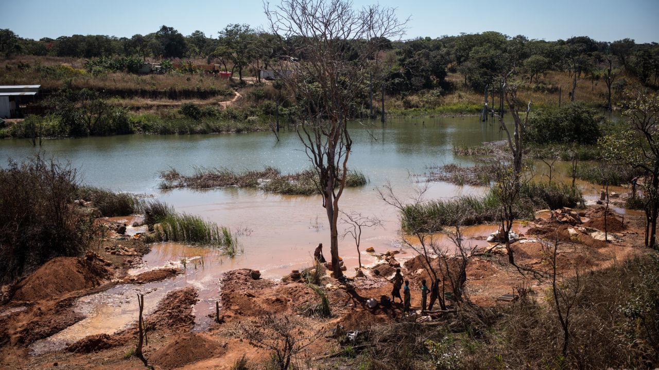 Workers extracting cobalt from a lake in Katanga province, DR Congo. 