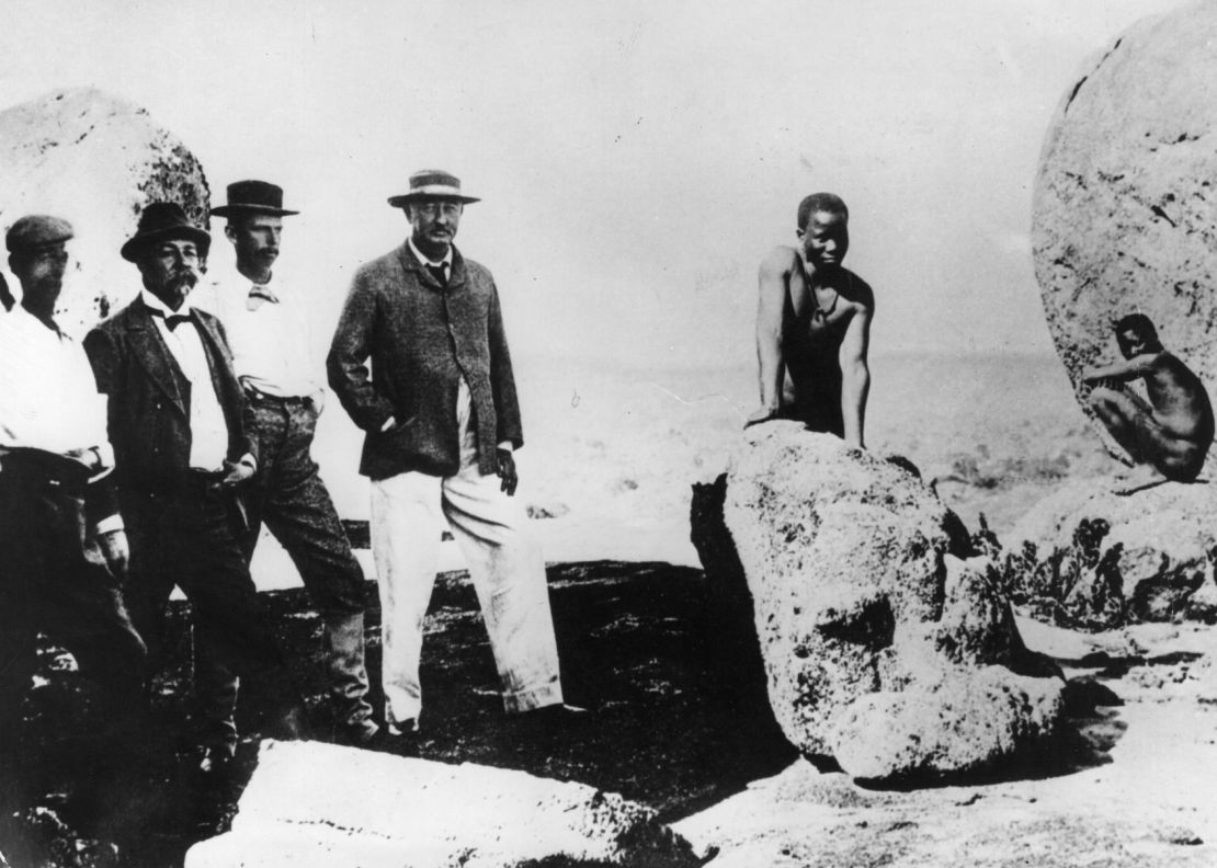 British businessman Cecil Rhodes (center) founded the De Beers diamond company in South Africa, implicated in colonial atrocities.
