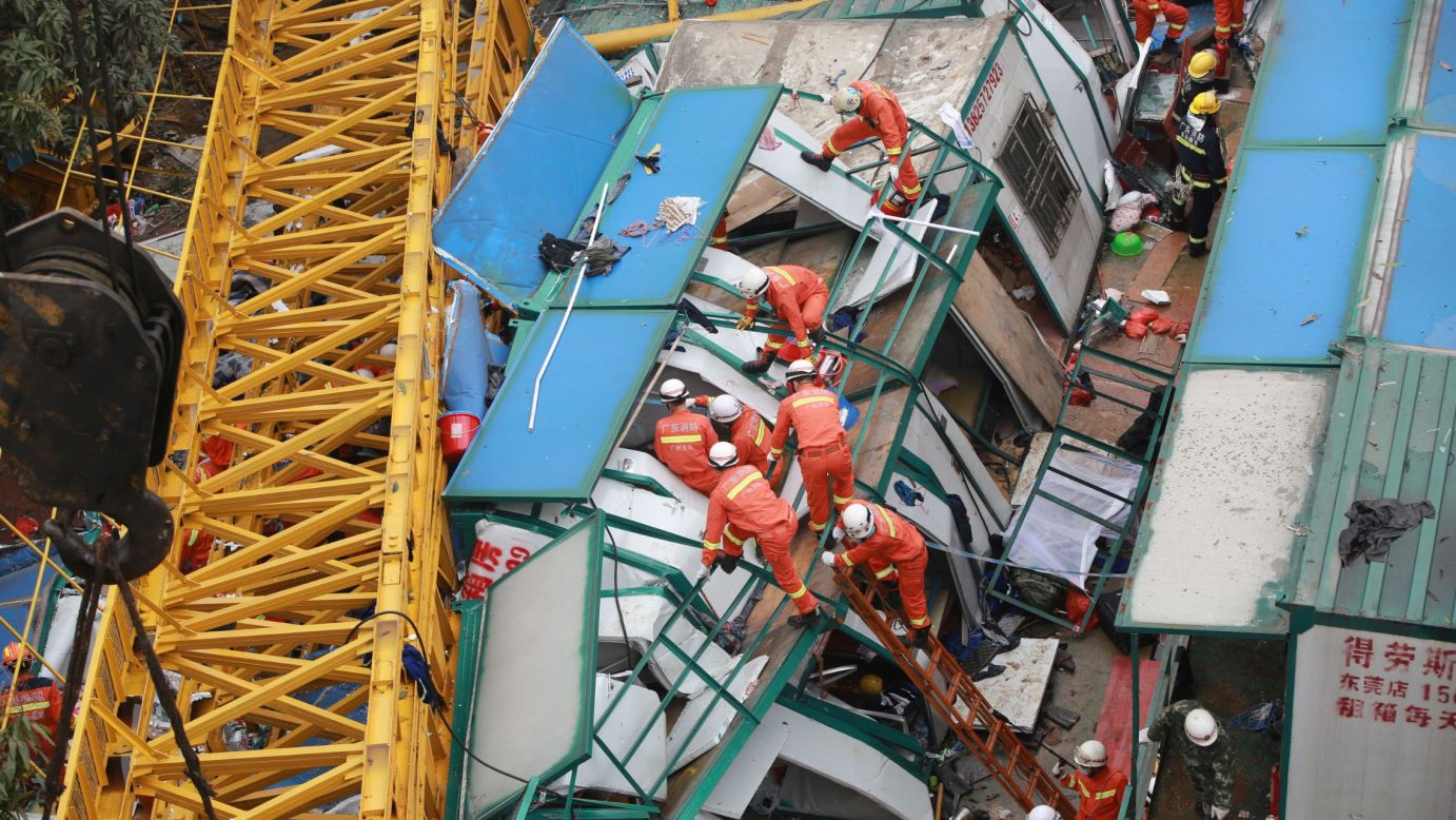Rescuers in Dongguan, China, work at a construction site where a crane collapsed in high winds and killed at least 18 people on Wednesday, April 13.