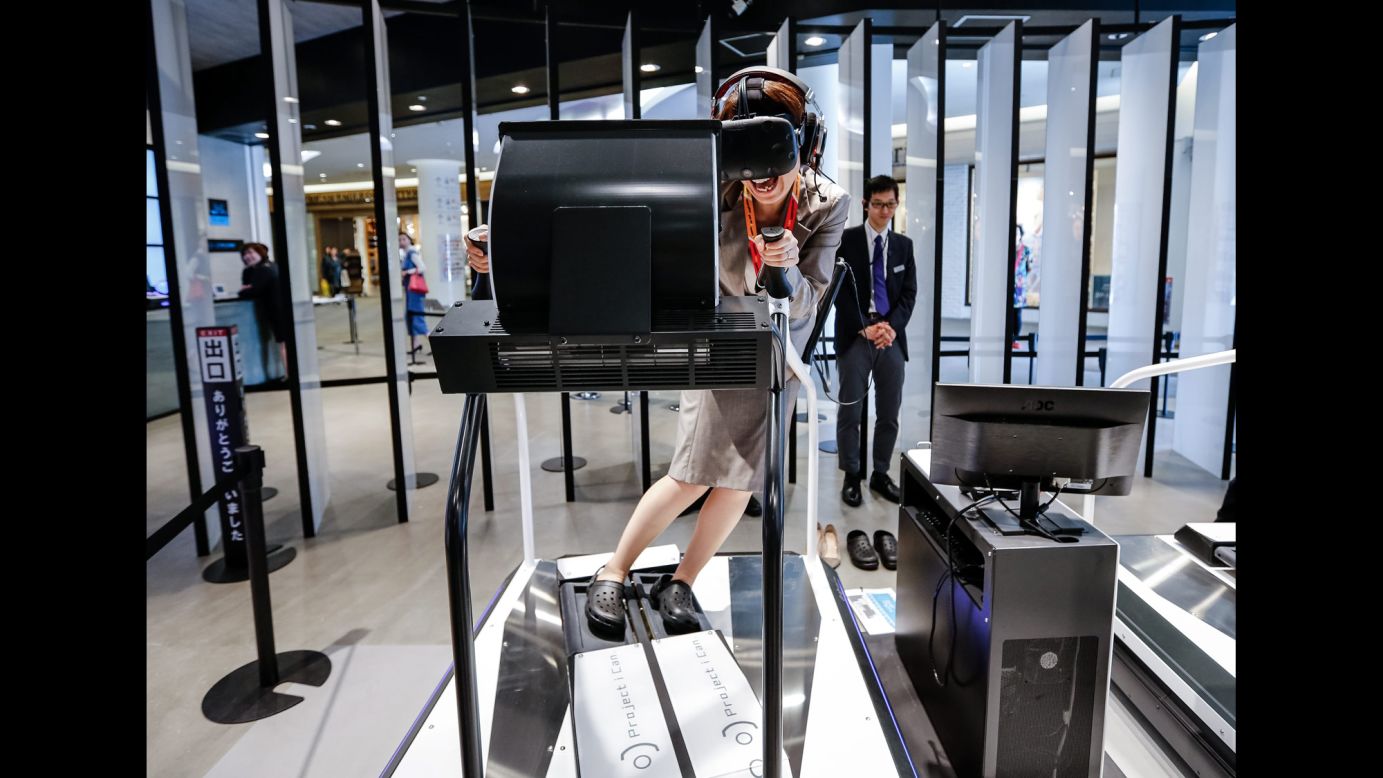A woman tests a virtual-reality game at a Tokyo shopping mall on Monday, April 11.