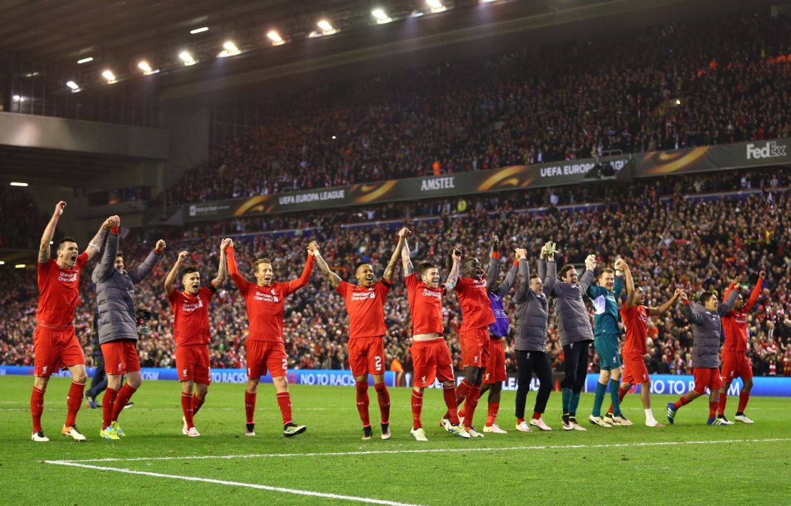 Liverpool players salute the Anfield crowd.