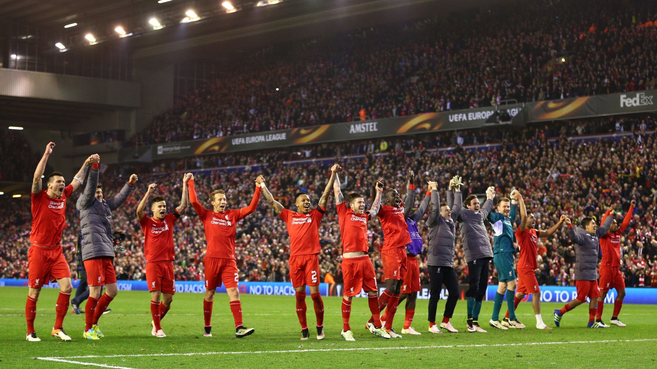 Liverpool players salute the Anfield crowd.