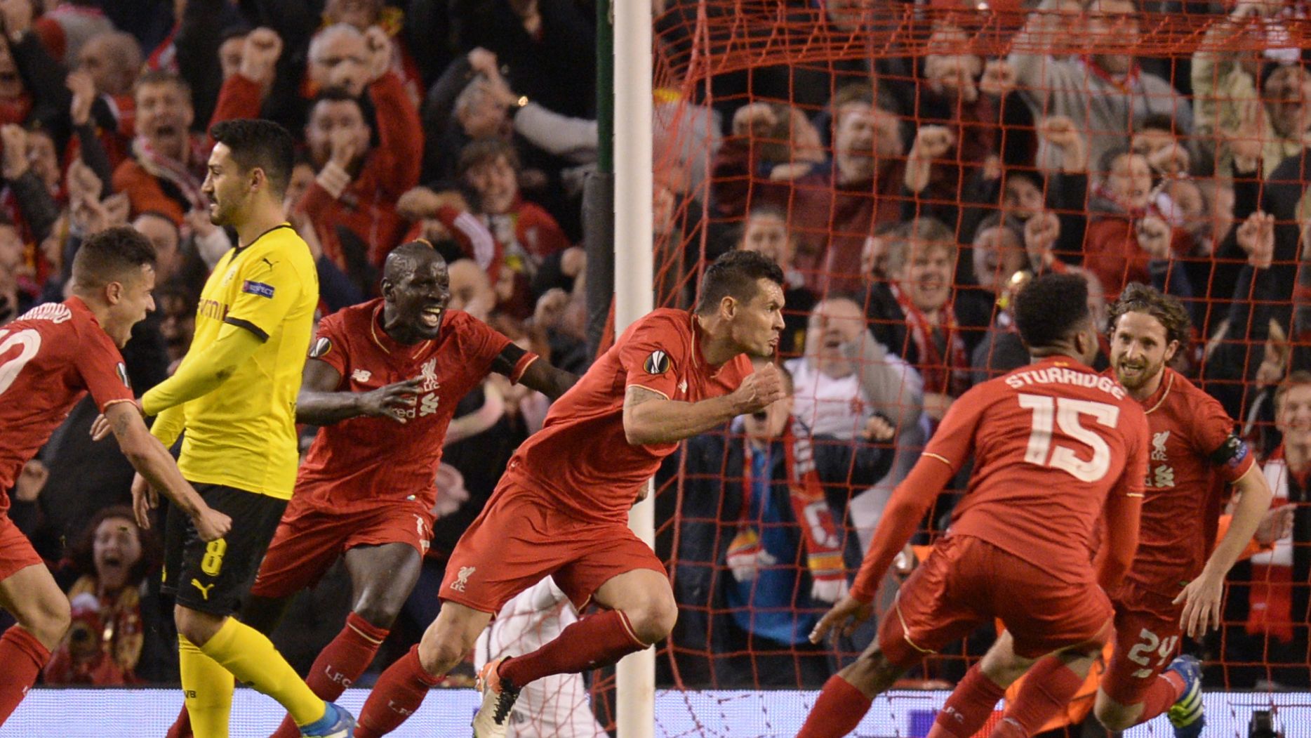 Dejan Lovren celebrates after scoring a late winning goal for Liverpool.