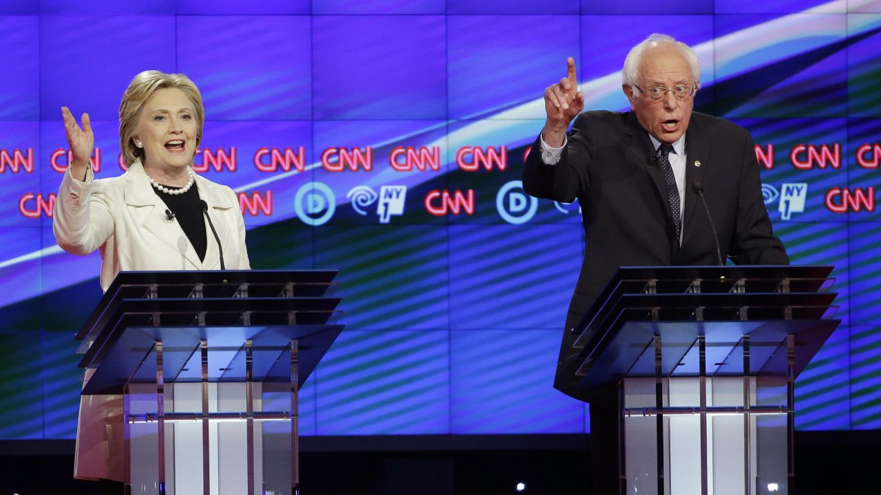 Democratic presidential candidates Sen. Bernie Sanders, I-Vt., right, and Hillary Clinton speak during the CNN Democratic Presidential Primary Debate at the Brooklyn Navy Yard on Thursday, April 14, 2016 in New York. (AP Photo/Seth Wenig)