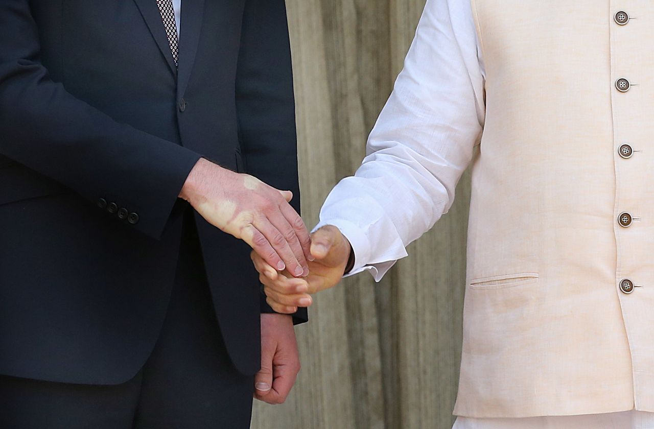 A strong handshake by Modi leaves an impression on Prince William's hand on April 12.