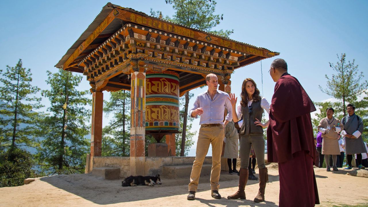 Britain's Prince William and his wife Catherine, the Duchess of Cambridge, chat with a monk in Thimphu, Bhutan, on Friday, April 15. 