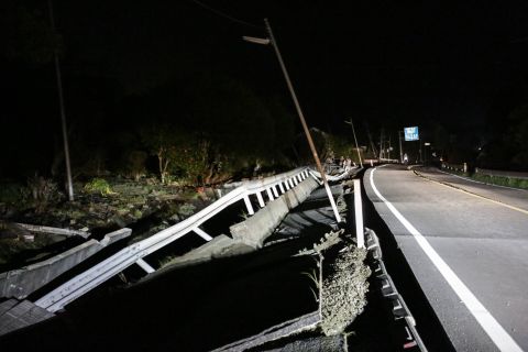 A road damaged by the 7.0 magnitude earthquake is seen on April 16 in Mashiki, Kumamoto, Japan. 