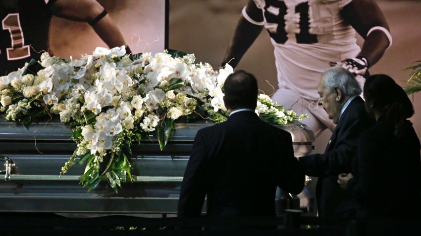 New Orleans Saints owner Tom Benson and his wife Gayle Benson view the casket of former Saints defensive end Will Smith during a public viewing inside the team's NFL football training facility in Metairie, Louisiana, Friday, April 15.