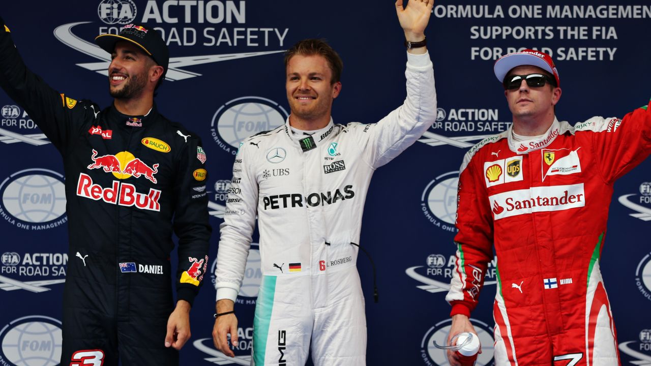 Nico Rosberg takes the pole plaudits flanked by Red Bull's Daniel Ricciardo and Kimi Raikkonen after qualifying for the Chinese Grand Prix in Shanghai.