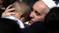Pope Francis hugs a child at the Moria detention center in Mytilene on April 16, 2016.  
Pope Francis received an emotional welcome today on the Greek island of Lesbos during a visit aimed at showing solidarity with migrants fleeing war and poverty. Pope Francis, Orthodox Patriarch Bartholomew and Archbishop Jerome visit Lesbos today to turn the spotlight on Europe's controversial deal with Turkey to end an unprecedented refugee crisis. / AFP / ARIS MESSINIS        (Photo credit should read ARIS MESSINIS/AFP/Getty Images)