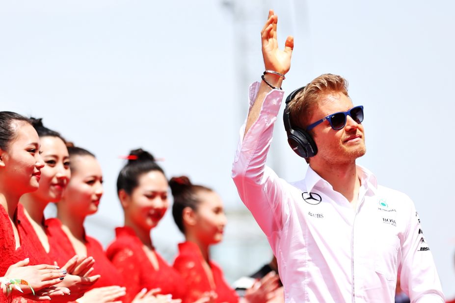 Nico Rosberg of Germany and Mercedes GP waves to the crowd on his way to the drivers parade ahead of the Formula One Grand Prix of China at Shanghai International Circuit on April 17, 2016.