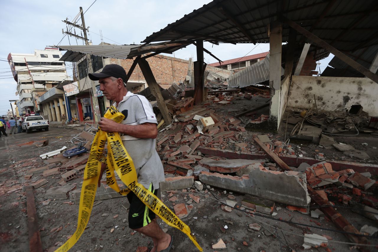 A man takes in the damage in Portoviejo on April 17.