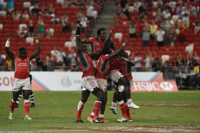 Kenya's players celebrate after beating Fiji during the cup final at the Singapore Sevens rugby tournament on April 17, 2016.