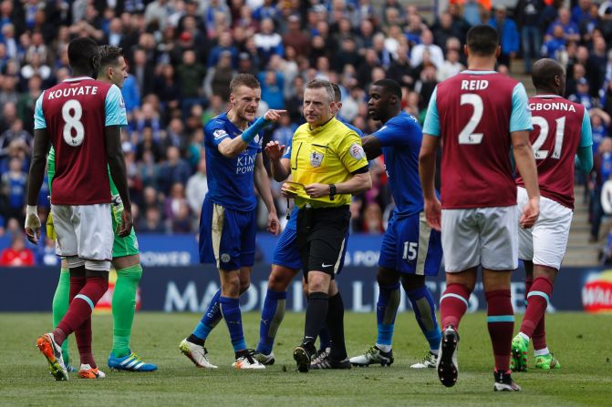 Leicester City's striker Jamie Vardy (3L) reacts after referee Jonathan Moss (C) showed Vardy his second yellow card for simulation to send him off during the English Premier League football match between Leicester City and West Ham United. Vardy will miss Leicester's next match. 