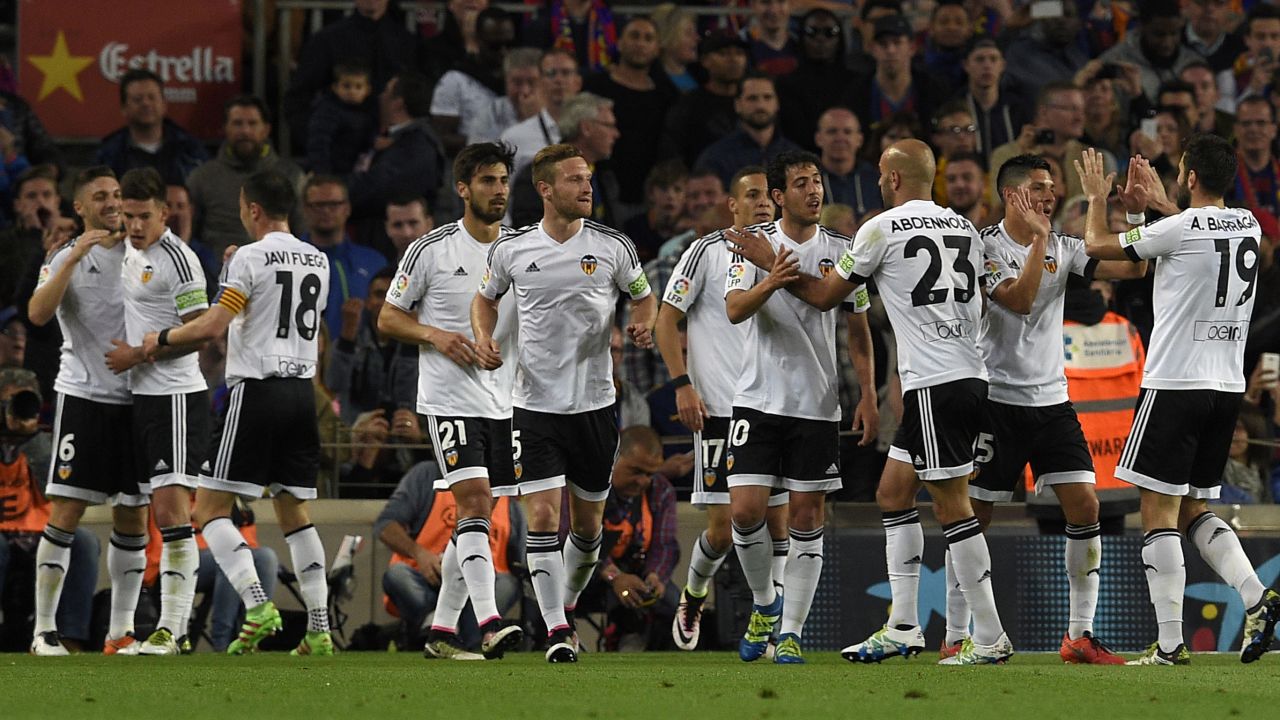 Valencia player celebrate the opening goal in the Nou Camp on the way to a shock 2-1 win.
