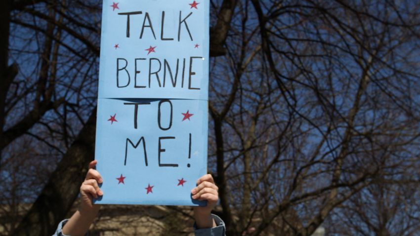 A Bernie Sanders supporter holds a sign at a small rally in Plattsburgh, New York on April 15, 2016.