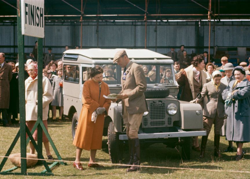 Queen Elizabeth II's relationship with Land Rover extends back to 1948, when her father King George VI was presented with the 100th production vehicle. Pictured is Her Majesty in 1956 at the Badminton Horse Trials in Gloucestershire, England. 