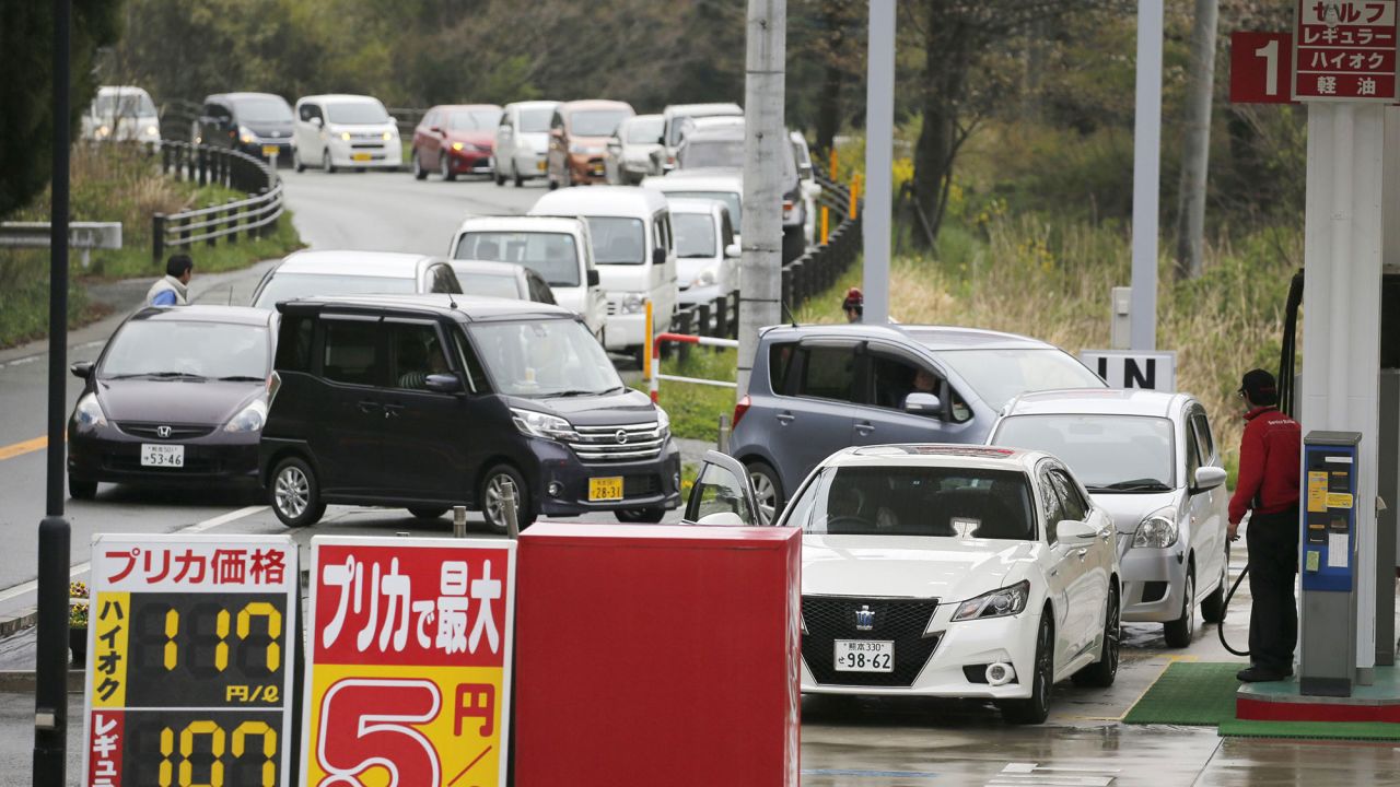 Vehicles line up to refuel at a gas station in Aso, Japan, on April 18.