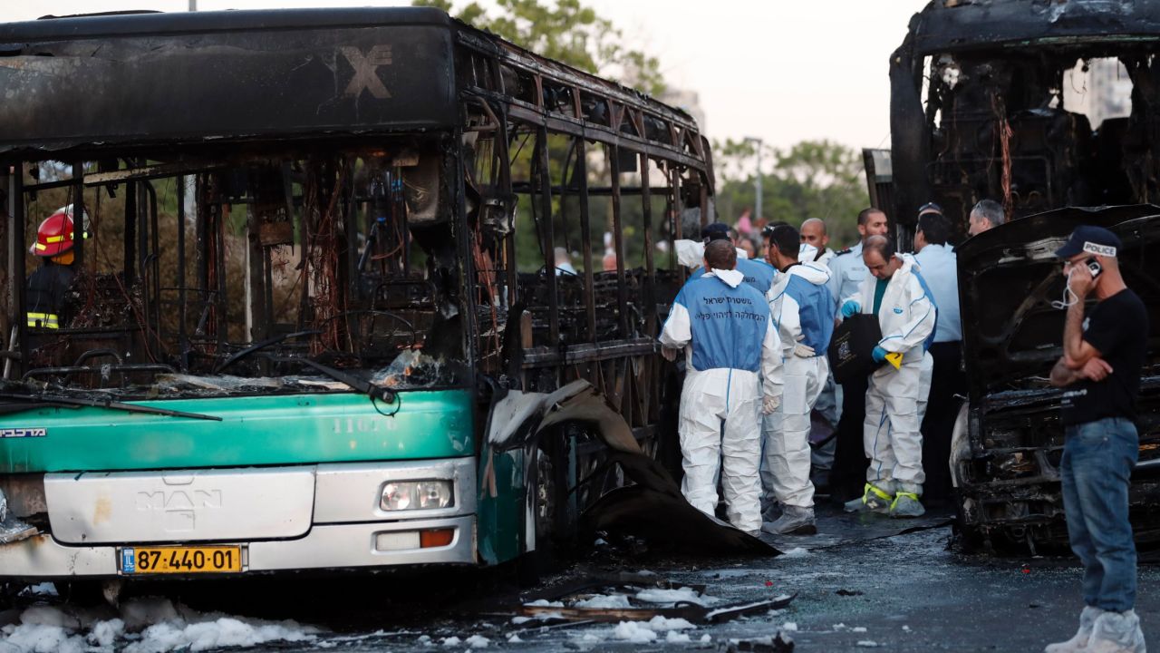 Israeli forensics search at the scene of an explosion on a bus in Jerusalem on April 18, 2016. 