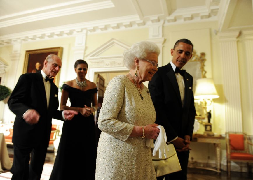 President Barack Obama sees off Queen Elizabeth II, as the Duke of Edinburgh and the first lady follow after a reciprocal dinner at the Winfield House in London, on May 25, 2011. 