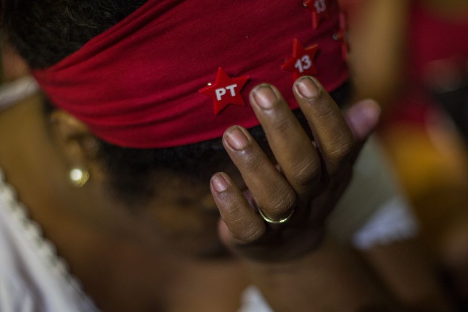 Protesters opposed to the impeachment react as they watch the voting session on television in Sao Paulo, Brazil. 