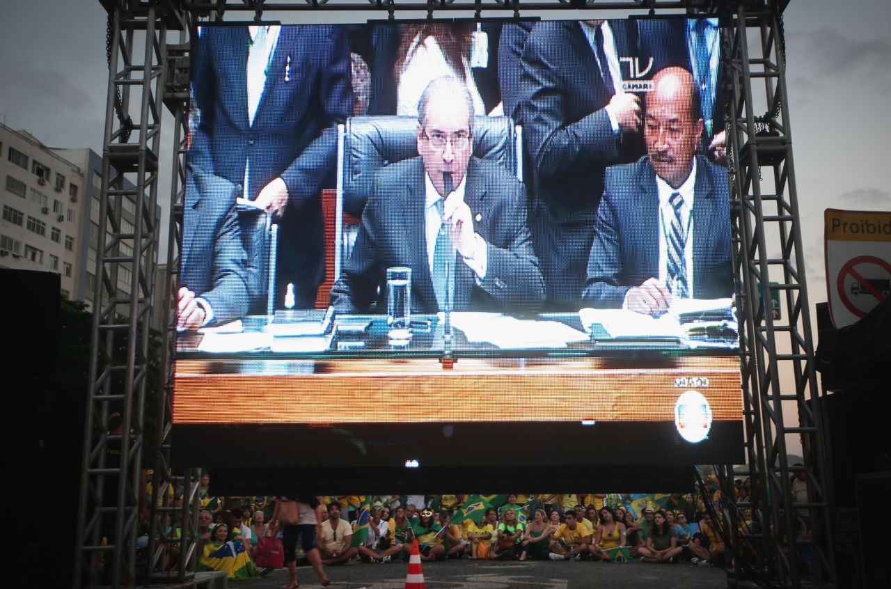 Pro-impeachment supporters watch a live television broadcast as Lower House Speaker Eduardo Cunha, himself under corruption investigation, speaks as deputies prepare to cast their votes in the impeachment process.