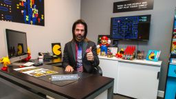 Billy Mitchell sits in his office at Metro Wrapz, in Hollywood, Florida, where he is developing custom arcade game covers.