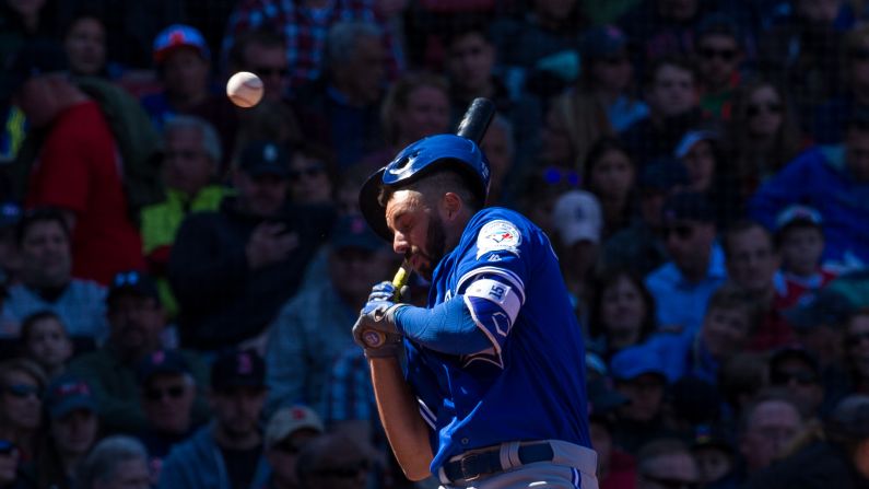 Chris Colabello of the Toronto Blue Jays is hit in the head by a pitch thrown by Steven Wright of the Boston Red Sox during the fourth inning at Fenway Park in Boston on April 17.