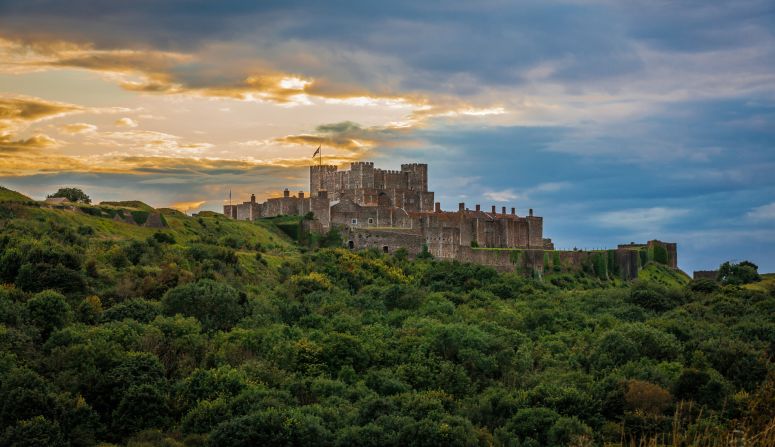 This beautiful hillside castle was built by King Henry II in the 1180s. In 2015 alone, <a href="index.php?page=&url=http%3A%2F%2Fwww.english-heritage.org.uk%2Fvisit%2Fplaces%2Fdover-castle%2F" target="_blank" target="_blank">Dover Castle</a> was featured in two TV and movie productions: "Avengers: Age of Ultron" and BBC's "Wolf Hall." In the cliffs underneath the castle lie a network of secret WWII tunnels and an underground hospital.