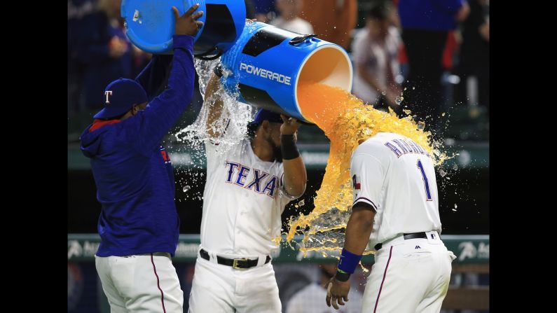 Hanser Alberto and Rougned Odor of the Texas Rangers celebrate with Elvis Andrus after the Rangers beat the Baltimore Orioles 6-3 at Globe Life Park in Arlington on April 14.
