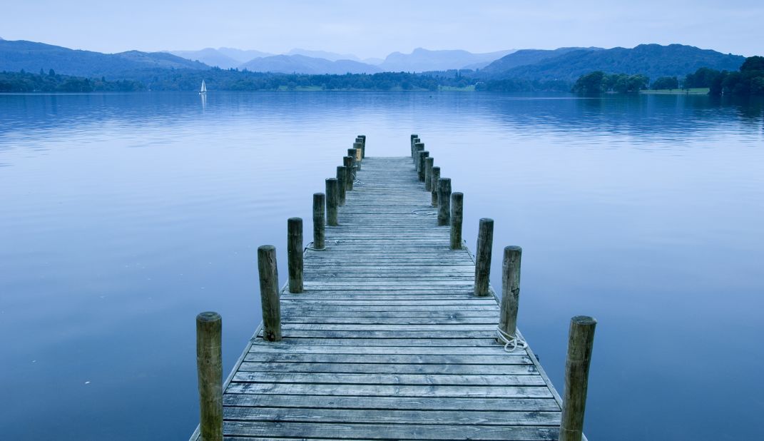 Windermere, 10.5 miles (17 kilometers) long and 219 feet (67 meters) deep, is England's largest lake. Part of the scenic Lake District National Park, its small cruise boats welcome more than 1.2 million visitors each year. <br /><a href="http://www.lakedistrict.gov.uk/visiting/placestogo/explorewindermere" target="_blank" target="_blank"><em>Lake Windermere</em></a><em>, Lake District National Park, Cumbria</em>