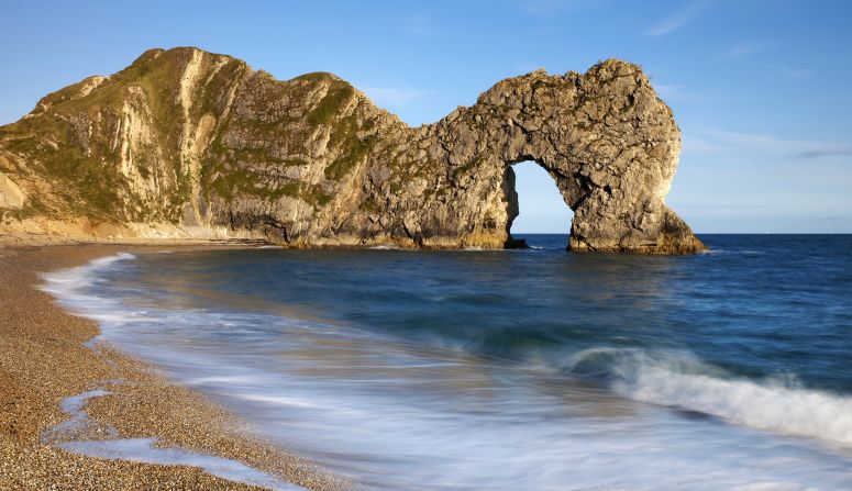 Some rocks and fossils found in the <a href="index.php?page=&url=http%3A%2F%2Fjurassiccoast.org%2Fabout%2F" target="_blank" target="_blank">Jurassic Coast</a>, covering southern England's Dorset and East Devon, are 185 million years old. It's England's first natural World Heritage Site. Durdle Door (pictured here) is an iconic natural limestone arch on the beach.