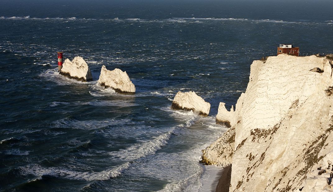 The Needles are three isolated rocks (a forth needle-shaped rock, which gave the group its name, collapsed in 1764) in a line off the coast of the Isle of Wight. One of the best ways to see them is from a chairlift in the nearby Alum Bay.