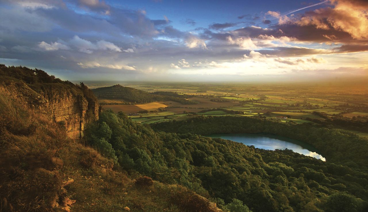 Sutton Bank is where the heather-clad <a href="http://www.northyorkmoors.org.uk/" target="_blank" target="_blank">North York Moors</a> give way to gorgeous views over the pancake-flat Vale of York. It's one of the three Dark Sky Discovery Sites in the area for star-gazing.