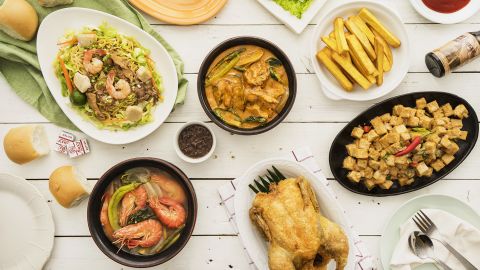Max's fried chicken has been a staple in the tables and celebrations of Filipino families, along with other favorite homegrown dishes such as (clockwise from top) lumpiang ubod, tokwa't baboy, sinigang na hipon, pancit, and kare-kare. 