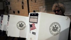 A woman casts her vote at a polling station in New York on April 19, 2016.