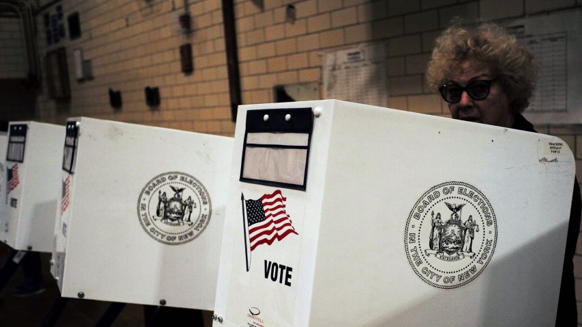 A woman casts her vote at a polling station in New York on April 19, 2016.
