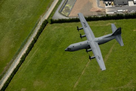A C-130J Super Hercules from the 37th Airlift Squadron flies over Normandy, France, June 3, 2015. First delivered to the Air Force in 1956, the C-130 remains one of the service's most important airlift platforms. More than 140 are still in active units, with more than 180 in the National Guard and a hundred more in the Reserve. The C-130 is powered by four turboprop engines.